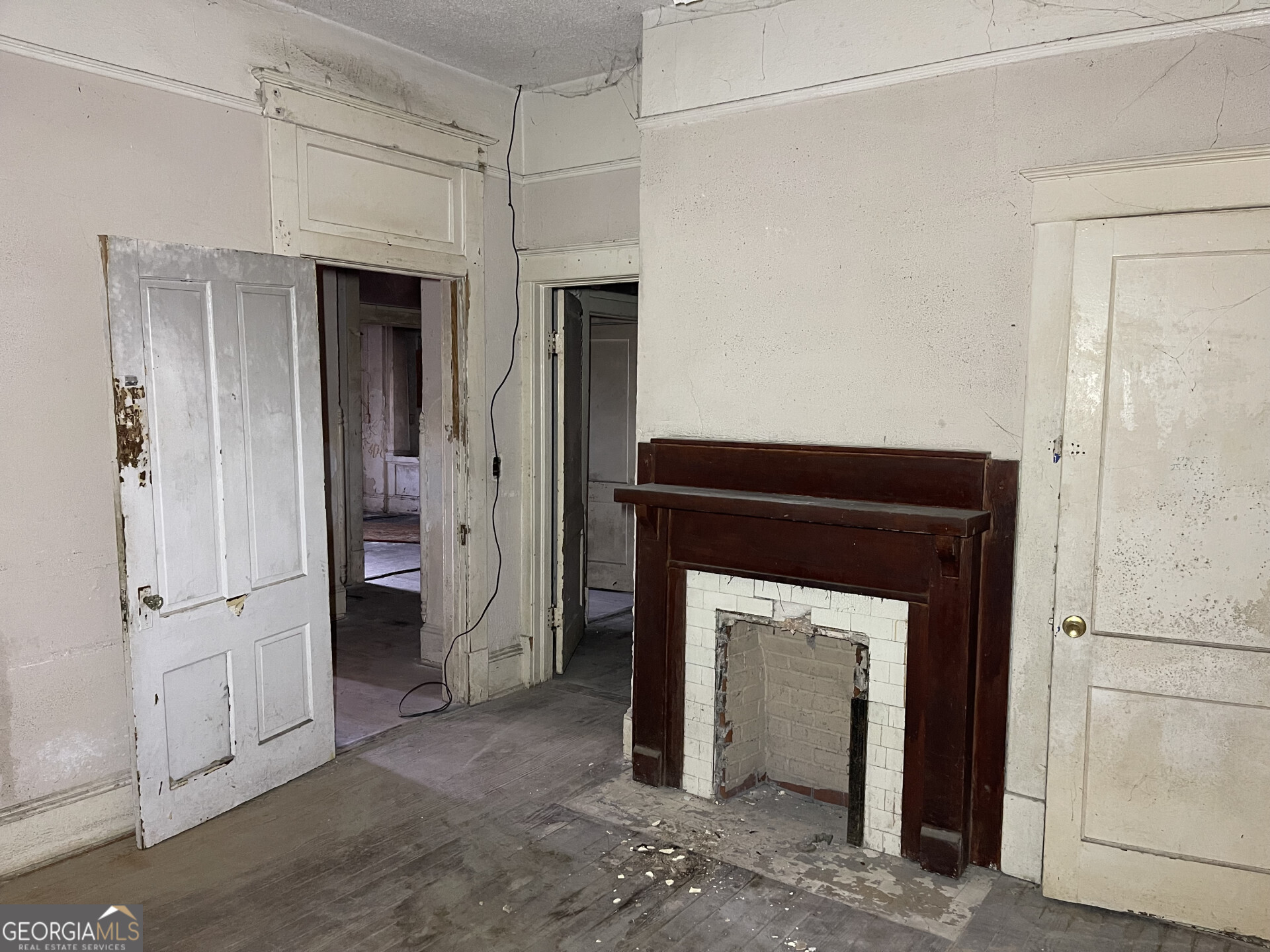1851 Coleman Avenue Macon, GA 31201 - Photo 16 of 23 a view of a livingroom with a fireplace and cabinet