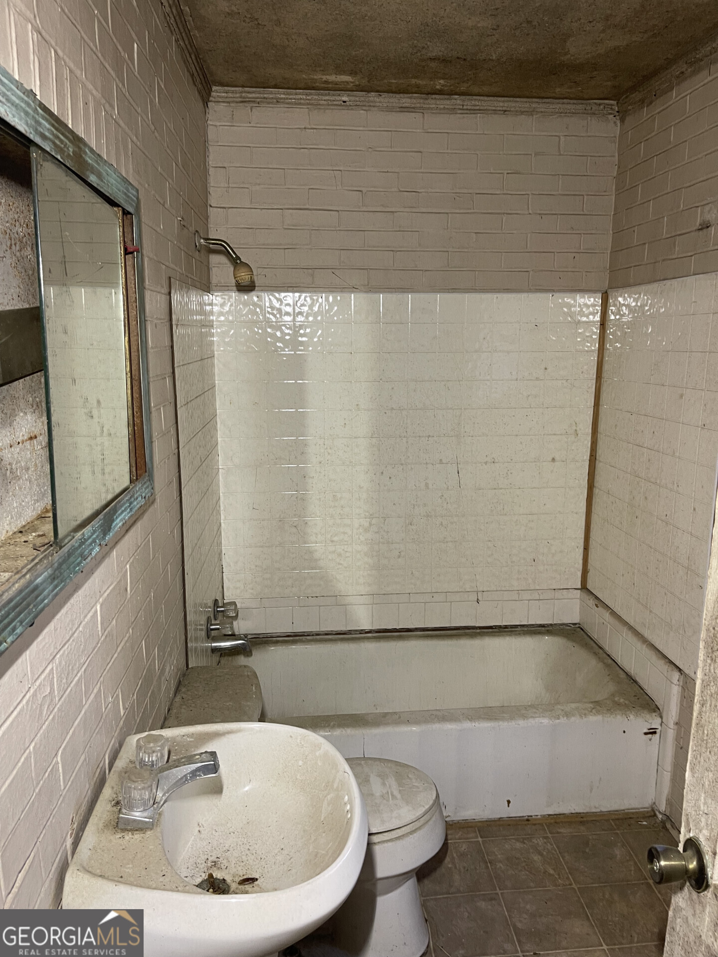 1851 Coleman Avenue Macon, GA 31201 - Photo 22 of 23 a bathroom with a sink a toilet and shower