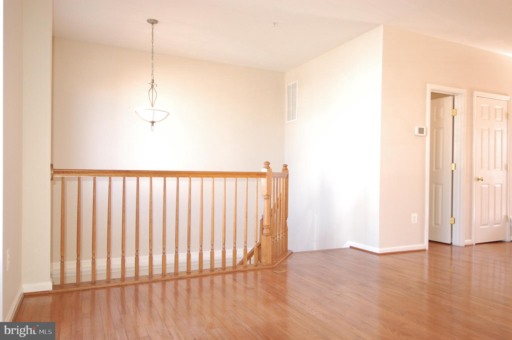 5033 Kemsley Road Rosedale, MD 21237 - Photo 10 of 63 Hardwood floor and oak staircases