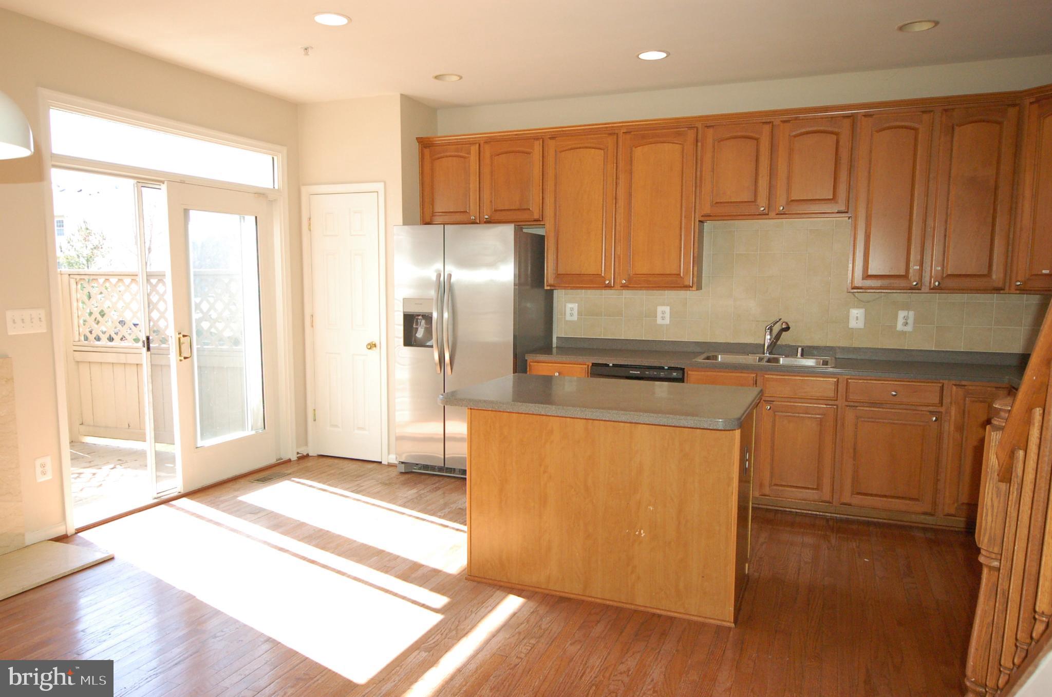 5033 Kemsley Road Rosedale, MD 21237 - Photo 17 of 63 Bright spacious kitchen with sliding door to deck