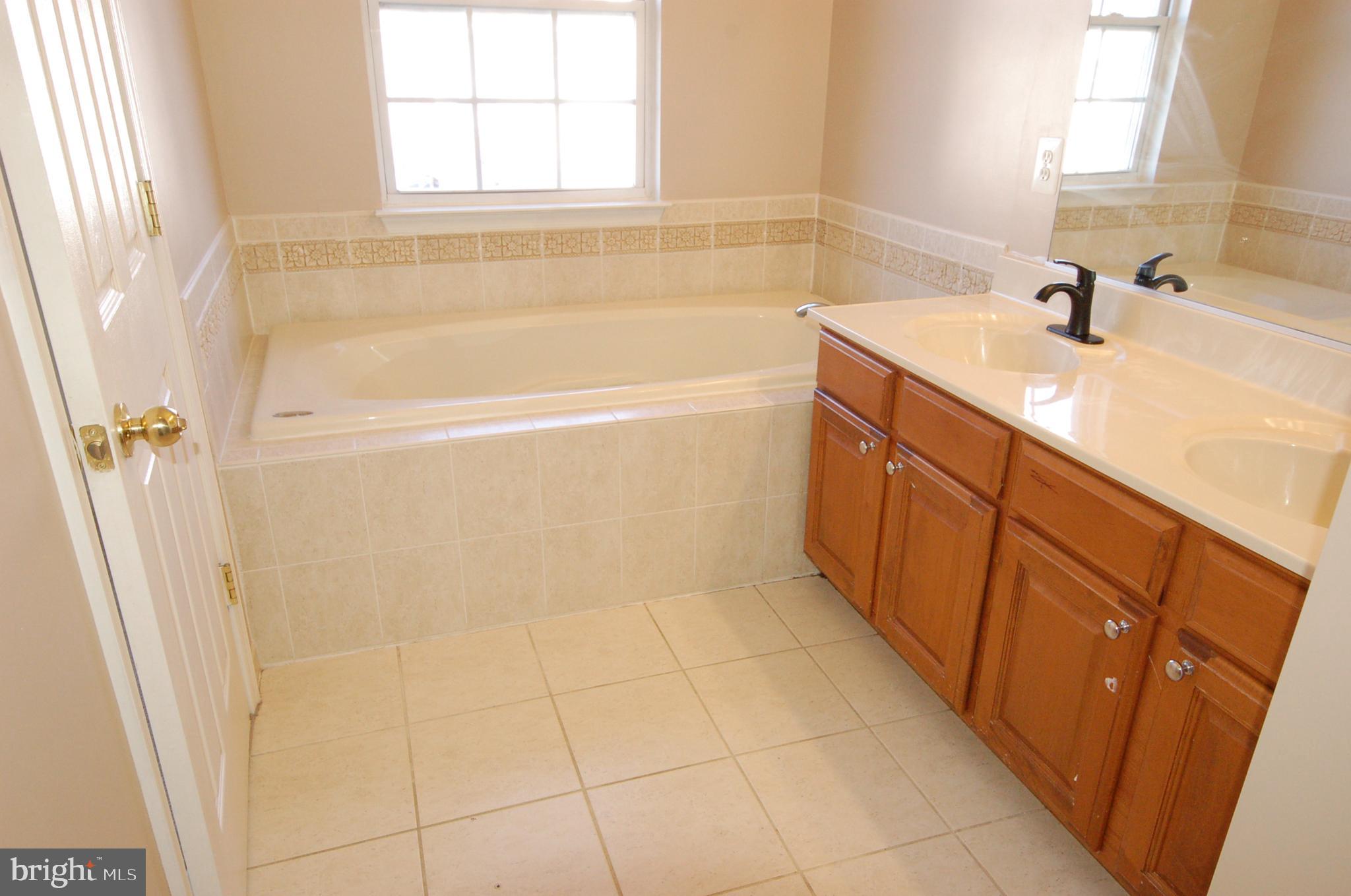 5033 Kemsley Road Rosedale, MD 21237 - Photo 20 of 63 Luxury primary bath separate shower and tub