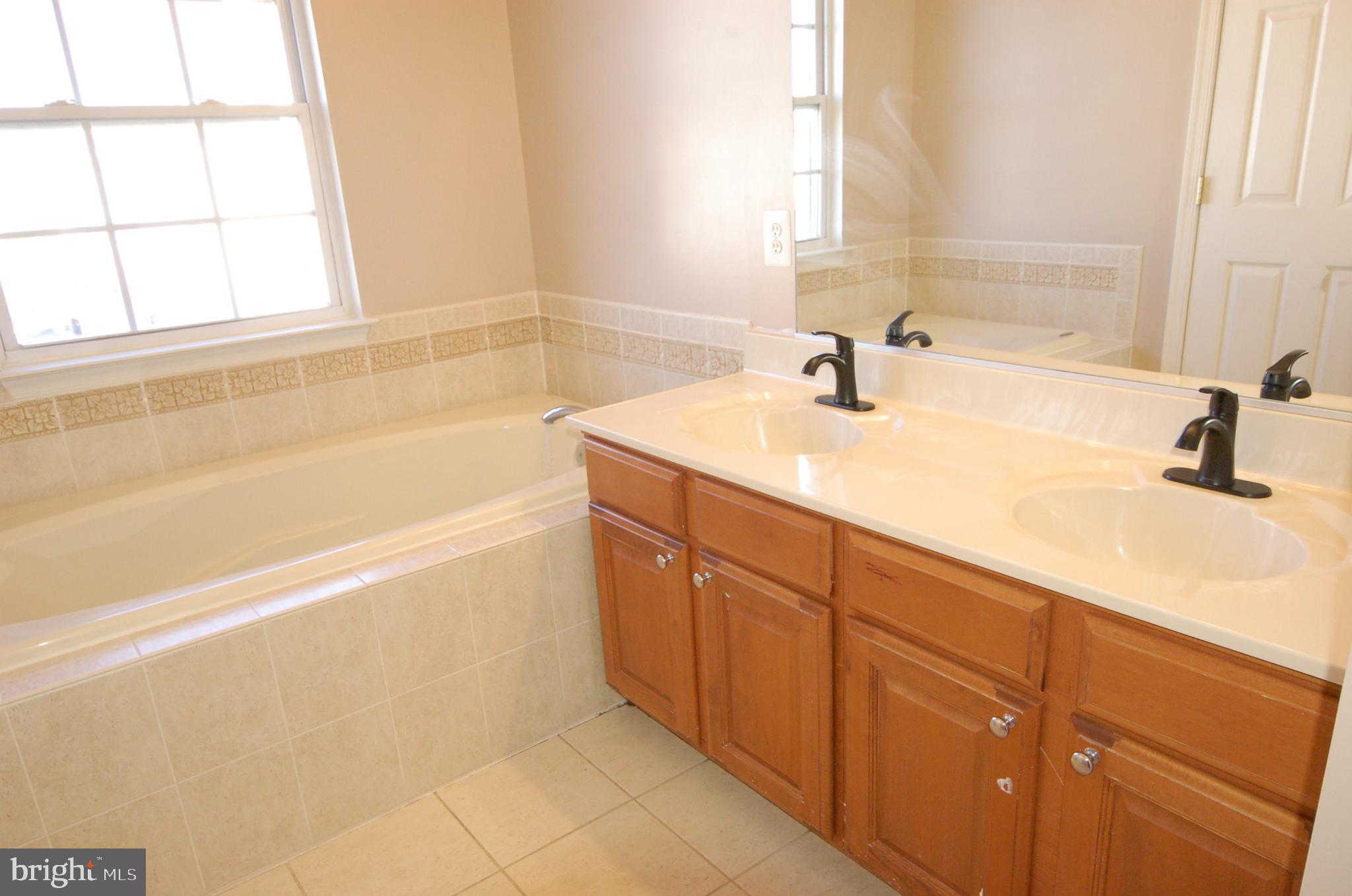5033 Kemsley Road Rosedale, MD 21237 - Photo 21 of 63 Luxury primary bath separate shower and tub