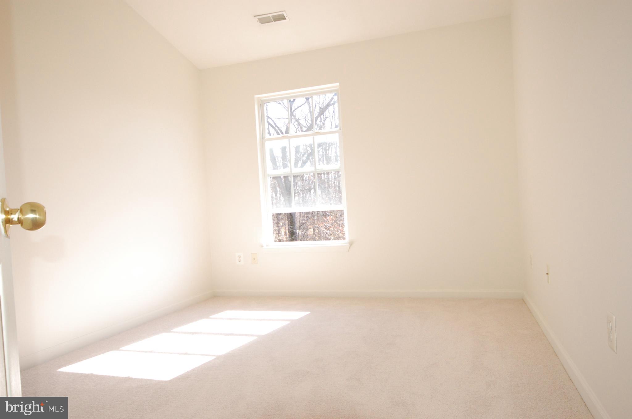 5033 Kemsley Road Rosedale, MD 21237 - Photo 36 of 63 Bedroom 2 Cathedral ceiling. Brand new carpet