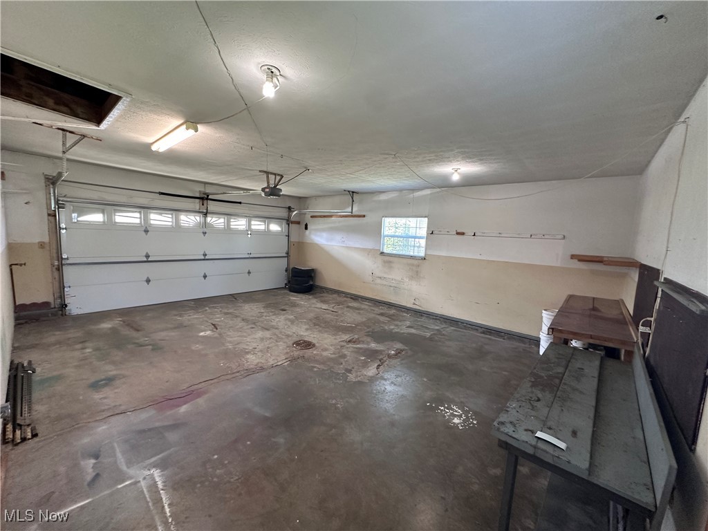 2829 Shellhart Road Barberton, OH 44203 - Photo 26 of 29 Garage featuring a garage door opener
