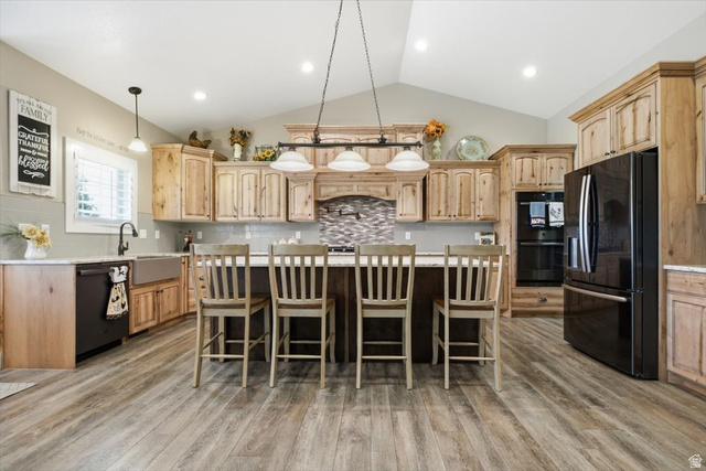 3123 East Riverdale Road Preston, ID 83263 - Photo 11 of 52 Kitchen featuring wood-finish flooring, vaulted ceilings, and recessed lighting