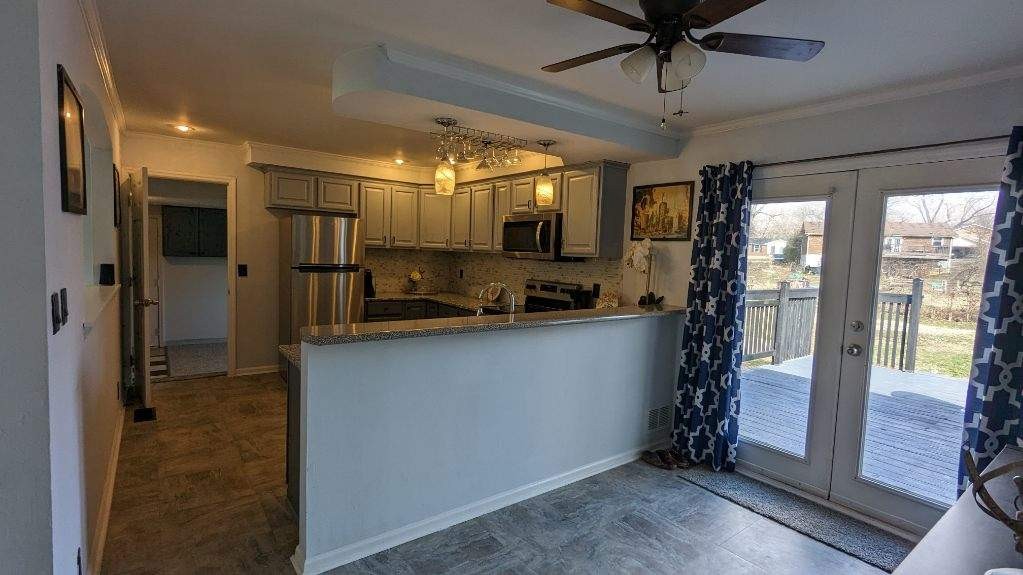 569 Lafayette Road Clarksville, TN 37042 - Photo 20 of 25 a kitchen with stainless steel appliances granite countertop a refrigerator and a sink