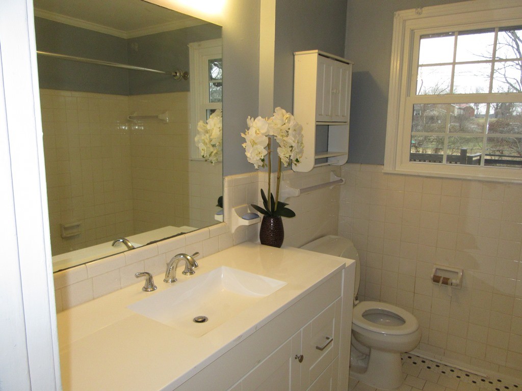 569 Lafayette Road Clarksville, TN 37042 - Photo 10 of 25 a bathroom with a sink and mirror with toilet