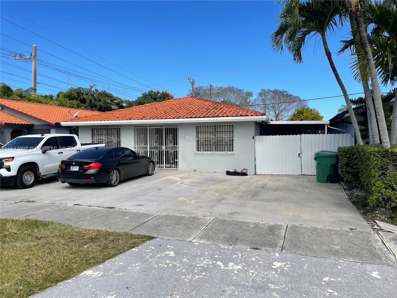 Tamiami Miami, FL 33175 - Photo 2 of 3 a view of a car park in front of house