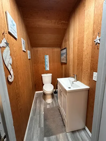 a bathroom with a sink a toilet and a shower