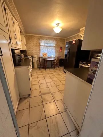 a view of living room with furniture and a flat screen tv