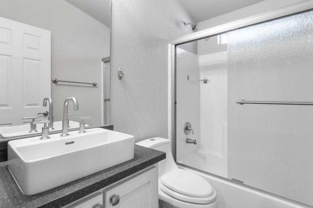 1545 East El Rodeo Road, Unit 42 Fort Mohave, AZ 86426 - Photo 28 of 45 a bathroom with a sink a toilet and shower