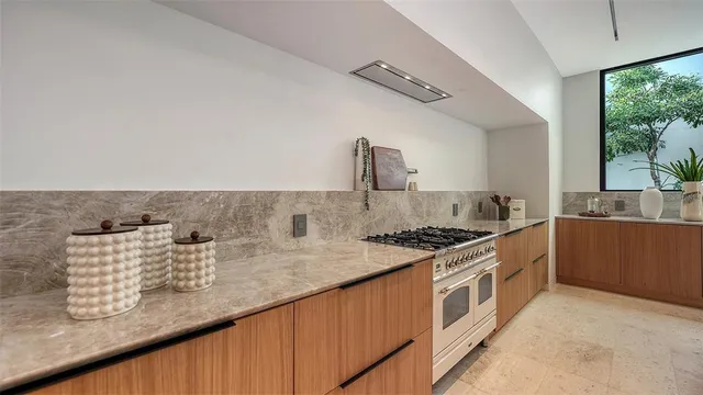 a view of a patio with a table and chairs