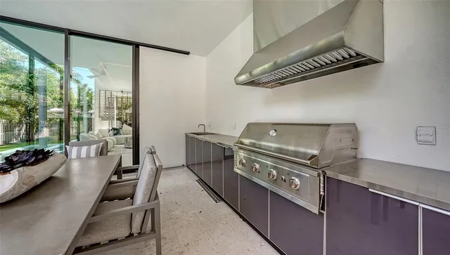 a bedroom with a large bed and a large window