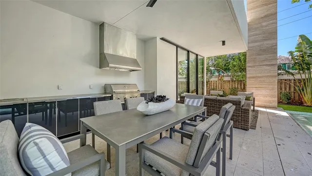 a bedroom with furniture and a large window