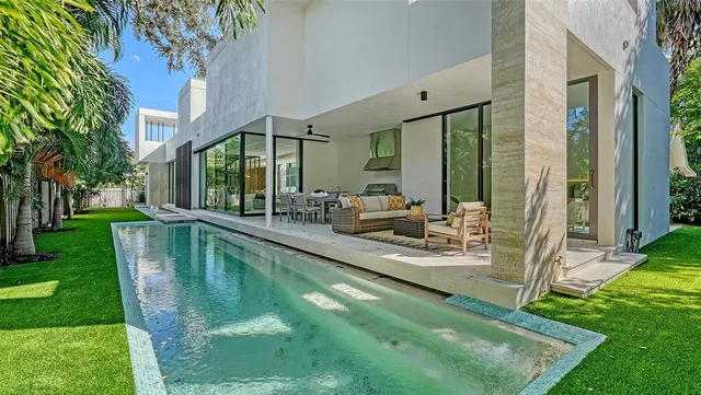a bedroom with a bed and a potted plant