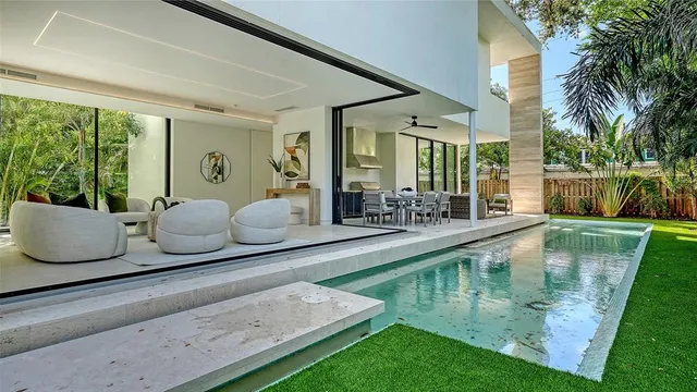 an empty room with wooden floor and a window