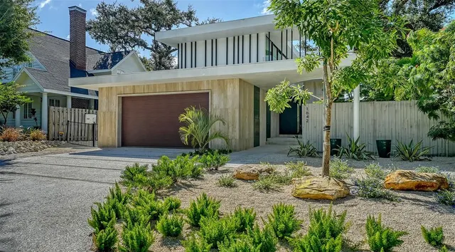 a view of a patio with a table chairs and a backyard