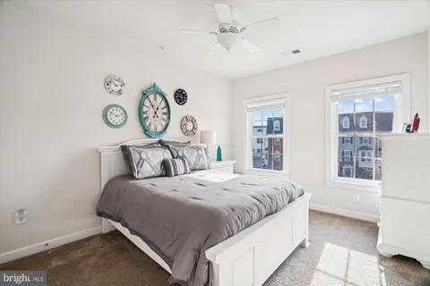 a bedroom with a bed and a television