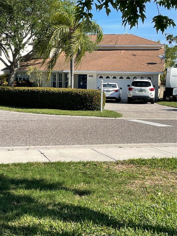 17601 Sterling Terrace Redington Shores, FL 33708 - Photo 1 of 1 a view of building with car parked