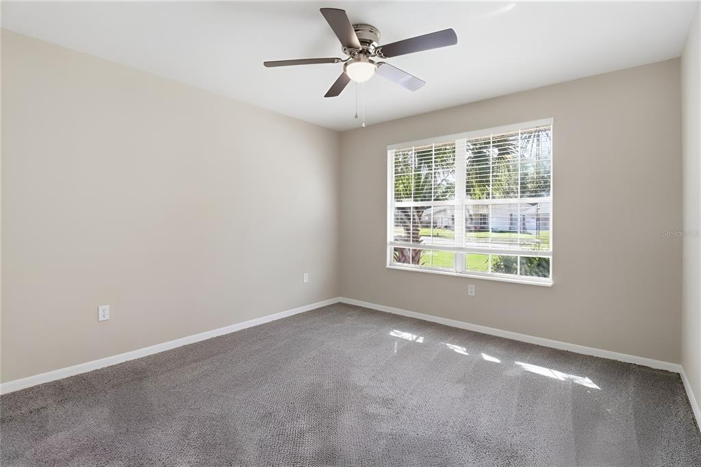 8105 Southwest 109th Street Ocala, FL 34481 - Photo 12 of 30 an empty room with a window and a fan