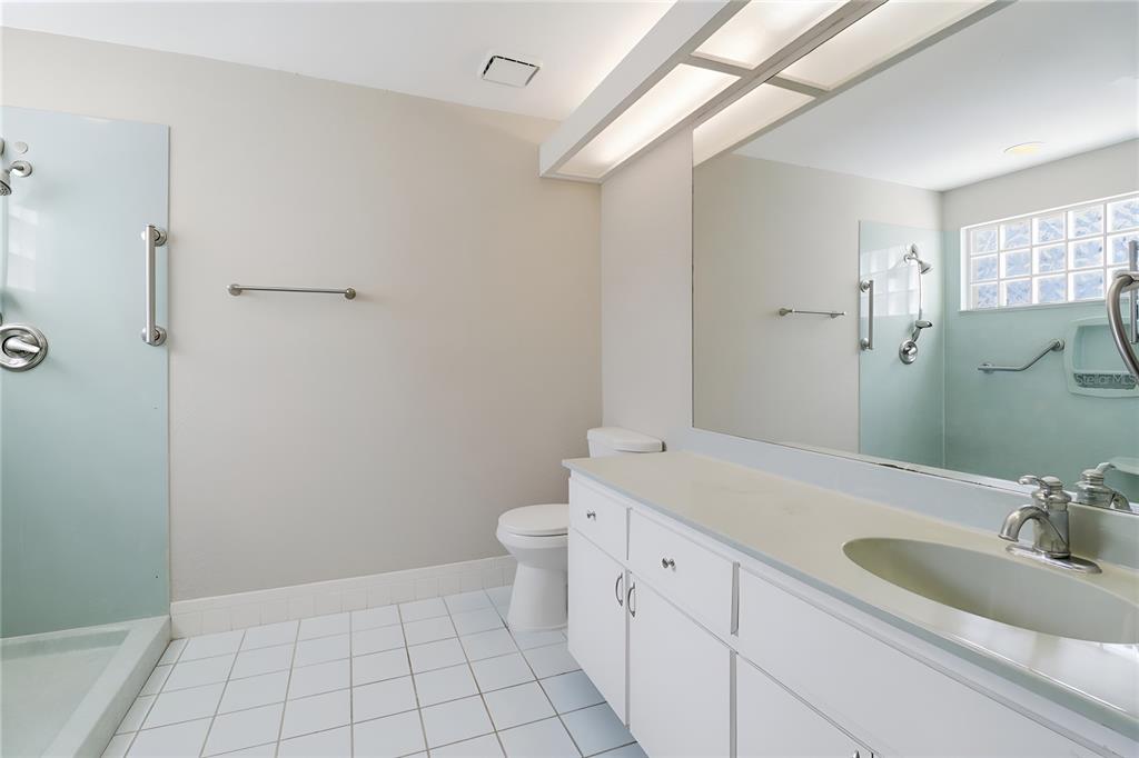 8105 Southwest 109th Street Ocala, FL 34481 - Photo 18 of 30 a bathroom with a sink a toilet and shower