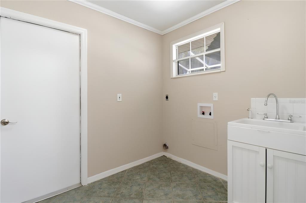 8105 Southwest 109th Street Ocala, FL 34481 - Photo 20 of 30 a room with a sink cabinets and utility