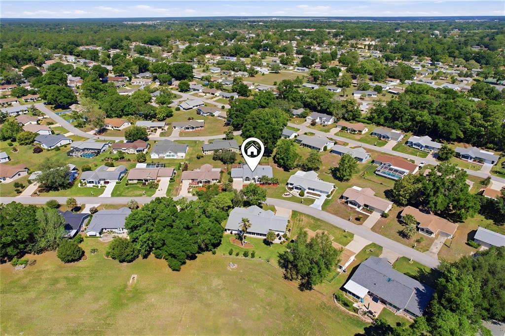 8105 Southwest 109th Street Ocala, FL 34481 - Photo 27 of 30 an aerial view of residential houses with outdoor space and trees