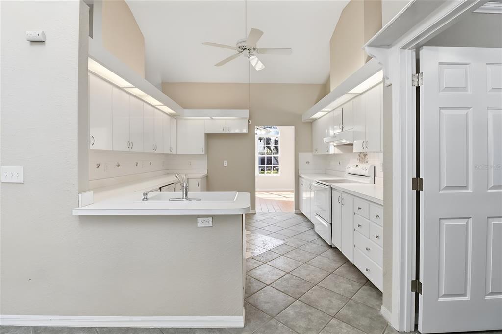 8105 Southwest 109th Street Ocala, FL 34481 - Photo 7 of 30 a kitchen with cabinets a sink and appliances