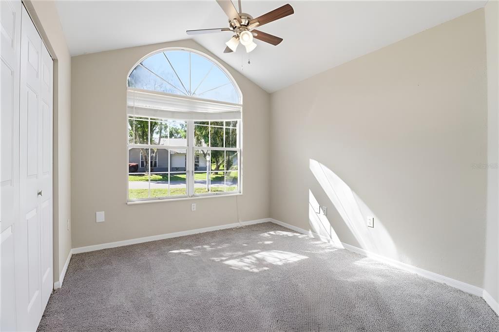 8105 Southwest 109th Street Ocala, FL 34481 - Photo 9 of 30 a view of a livingroom with a ceiling fan and window