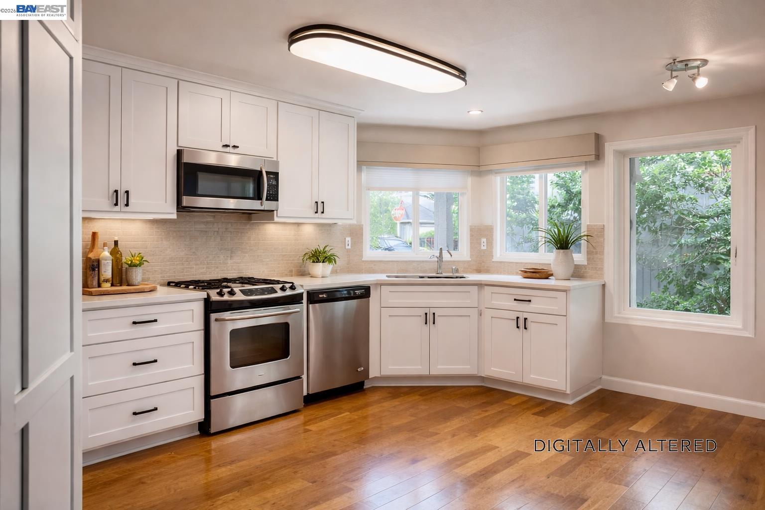 212 Puddingstone Road Alameda, CA 94502 - Photo 5 of 24 a kitchen with granite countertop a stove a sink and a window