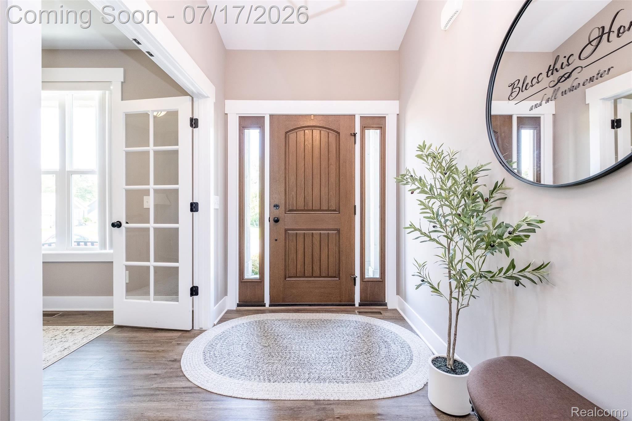 12349 Sugar Maple Drive Fenton, MI 48430 - Photo 5 of 67 Entryway featuring a paneled wood-finish door with sidelight windows, wood-finish flooring, and white trim throughout