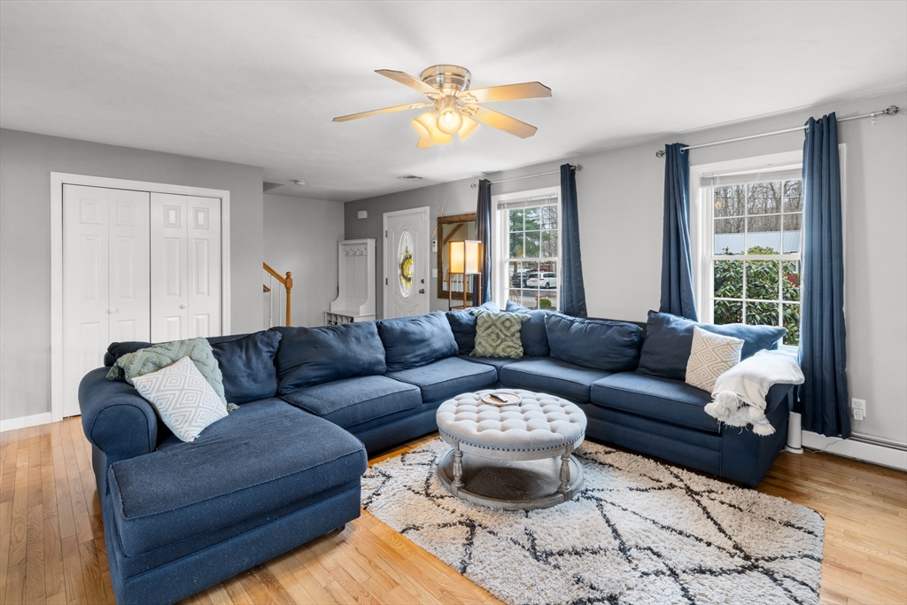 12 Pinckney Street, Unit A Taunton, MA 02780 - Photo 13 of 42 a living room with furniture and a large window