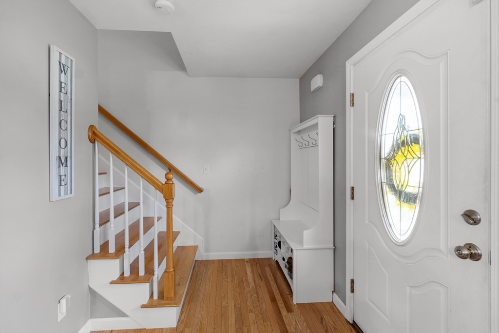 12 Pinckney Street, Unit A Taunton, MA 02780 - Photo 19 of 42 a view of an entryway with wooden floor and windows