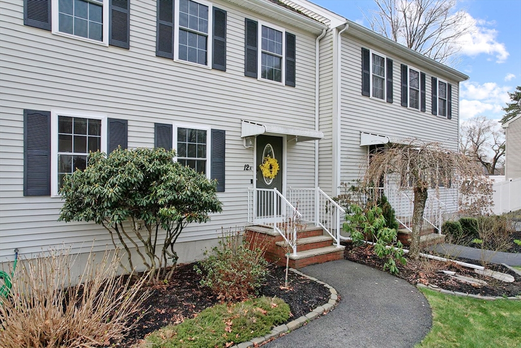 12 Pinckney Street, Unit A Taunton, MA 02780 - Photo 2 of 42 a front view of a house with garden