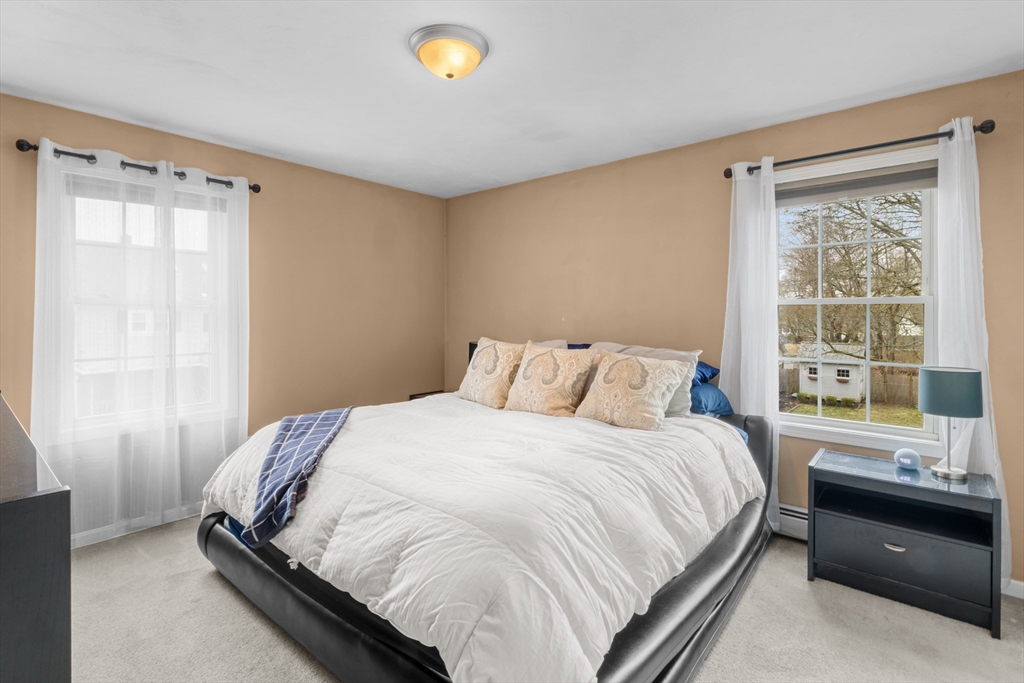 12 Pinckney Street, Unit A Taunton, MA 02780 - Photo 21 of 42 a bedroom with a bed and a window