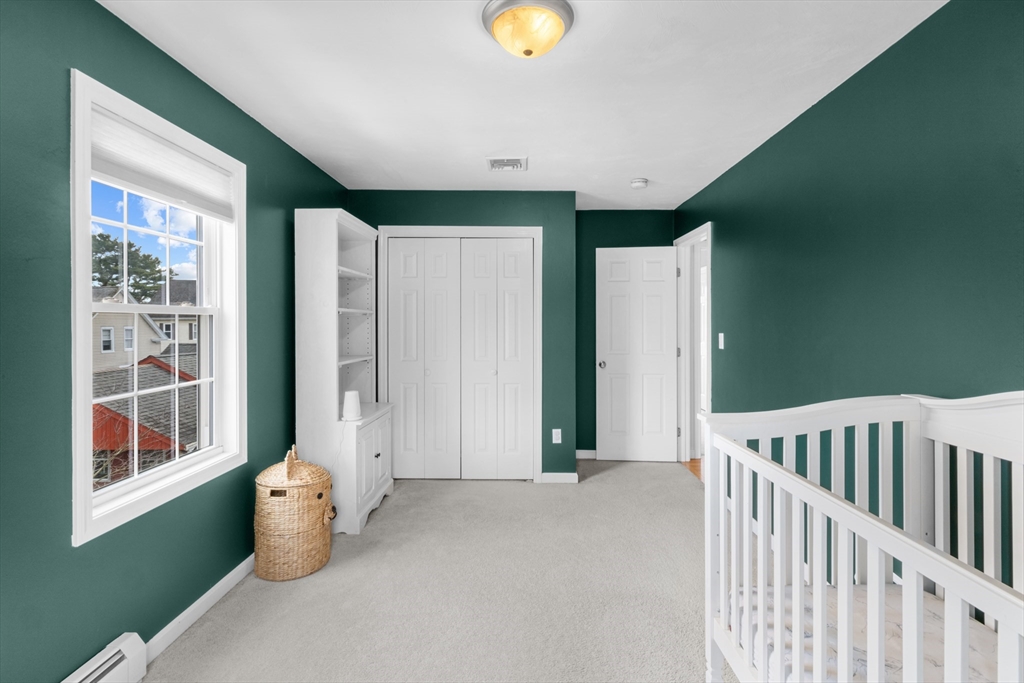 12 Pinckney Street, Unit A Taunton, MA 02780 - Photo 26 of 42 a view of an empty room with window and interior of house