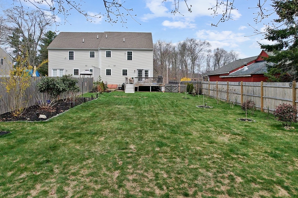 12 Pinckney Street, Unit A Taunton, MA 02780 - Photo 3 of 42 a view of a house with a backyard