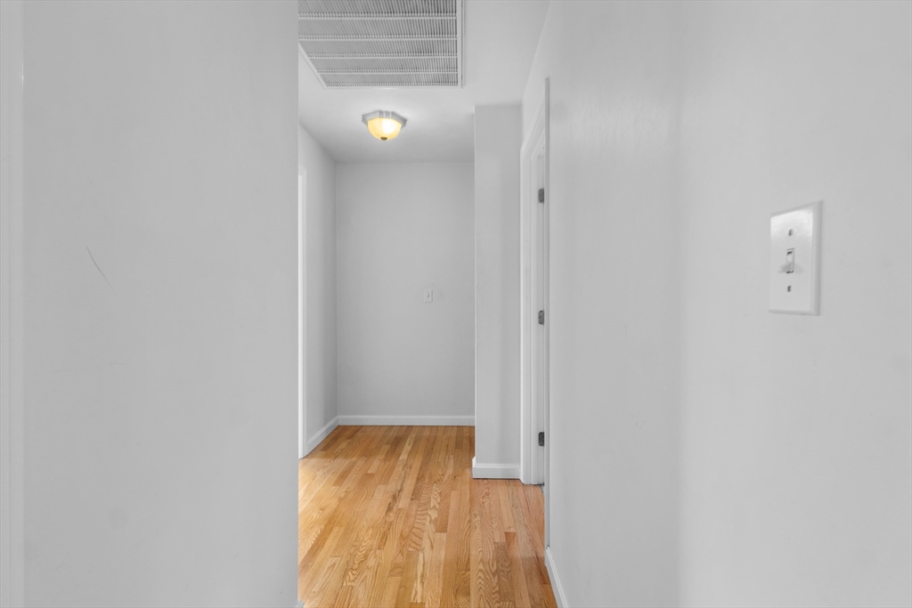 12 Pinckney Street, Unit A Taunton, MA 02780 - Photo 31 of 42 a view of a room with wooden floor and small space