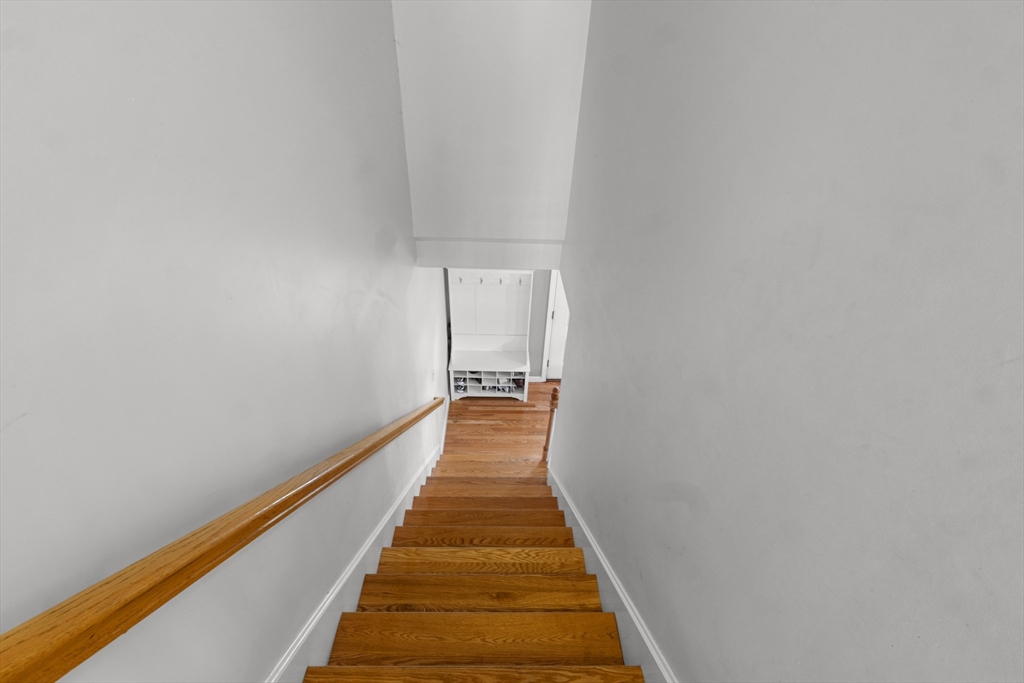 12 Pinckney Street, Unit A Taunton, MA 02780 - Photo 32 of 42 a view of a hallway with wooden floor