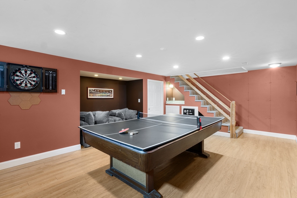 12 Pinckney Street, Unit A Taunton, MA 02780 - Photo 33 of 42 a living room with table tennis and stairs