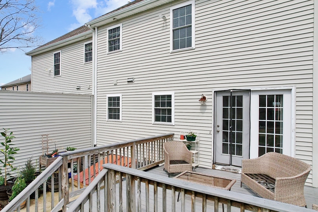 12 Pinckney Street, Unit A Taunton, MA 02780 - Photo 37 of 42 a view of a house with a deck