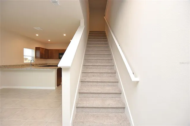 a view of entryway and kitchen