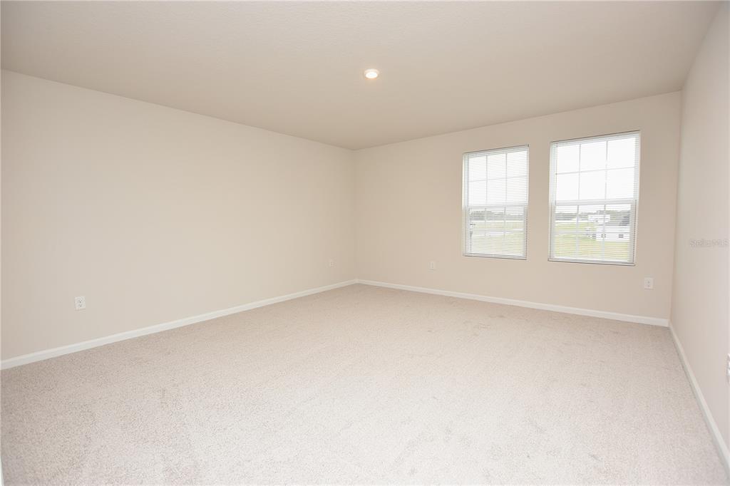 622 Manchester Path Dundee, FL 33838 - Photo 22 of 46 an empty room with a window