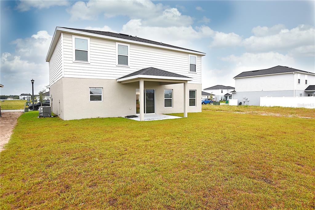 622 Manchester Path Dundee, FL 33838 - Photo 39 of 46 a view of a house with an outdoor space