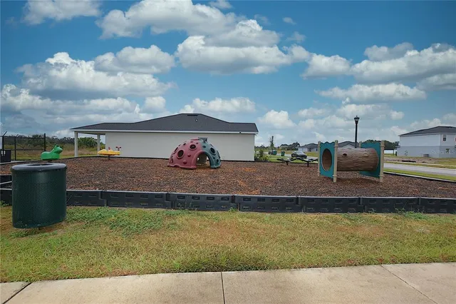 a view of a swimming pool with a lounge chair