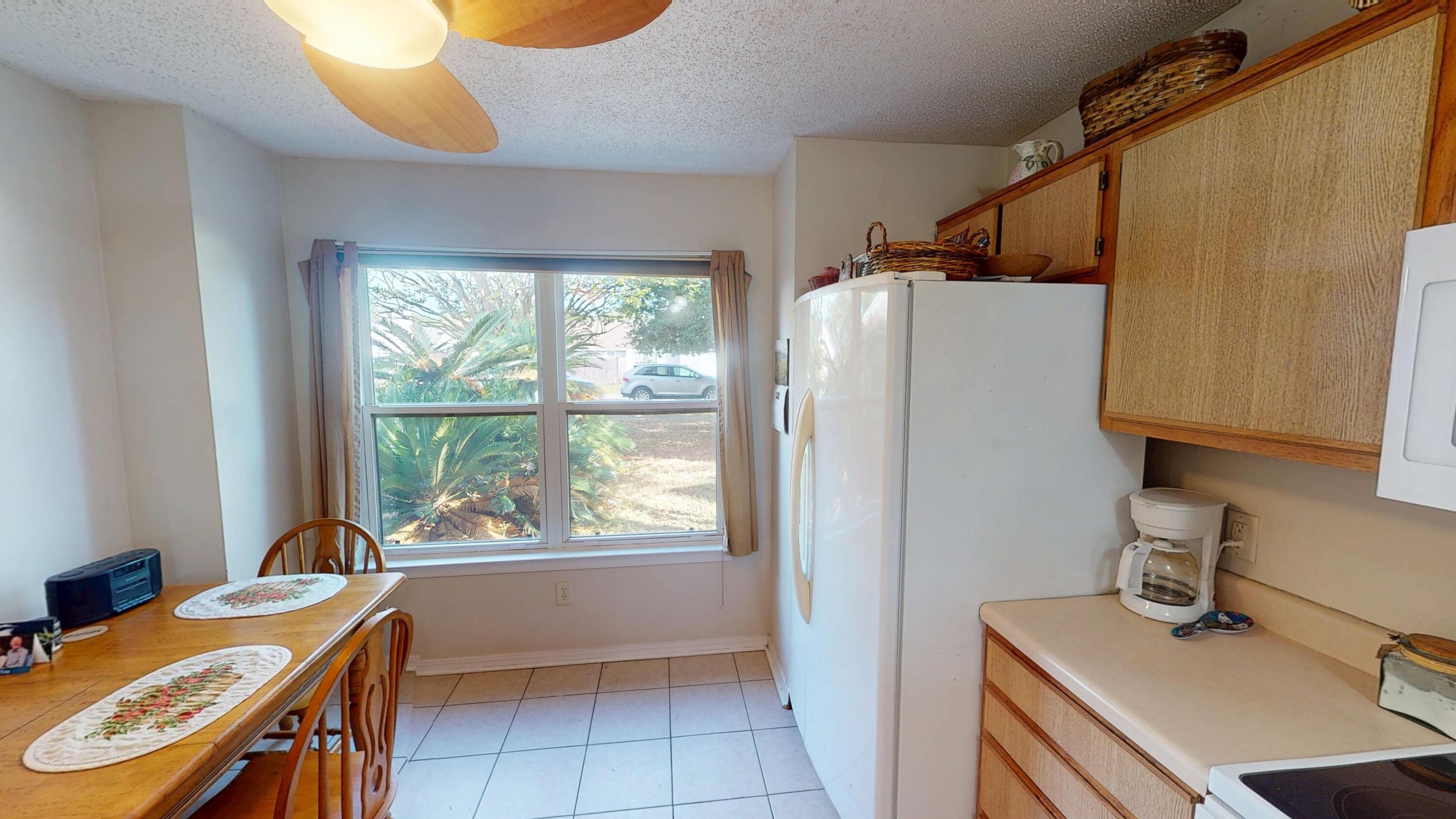 2293 Estate Circle Navarre, FL 32566 - Photo 15 of 41 a view of a kitchen with a window