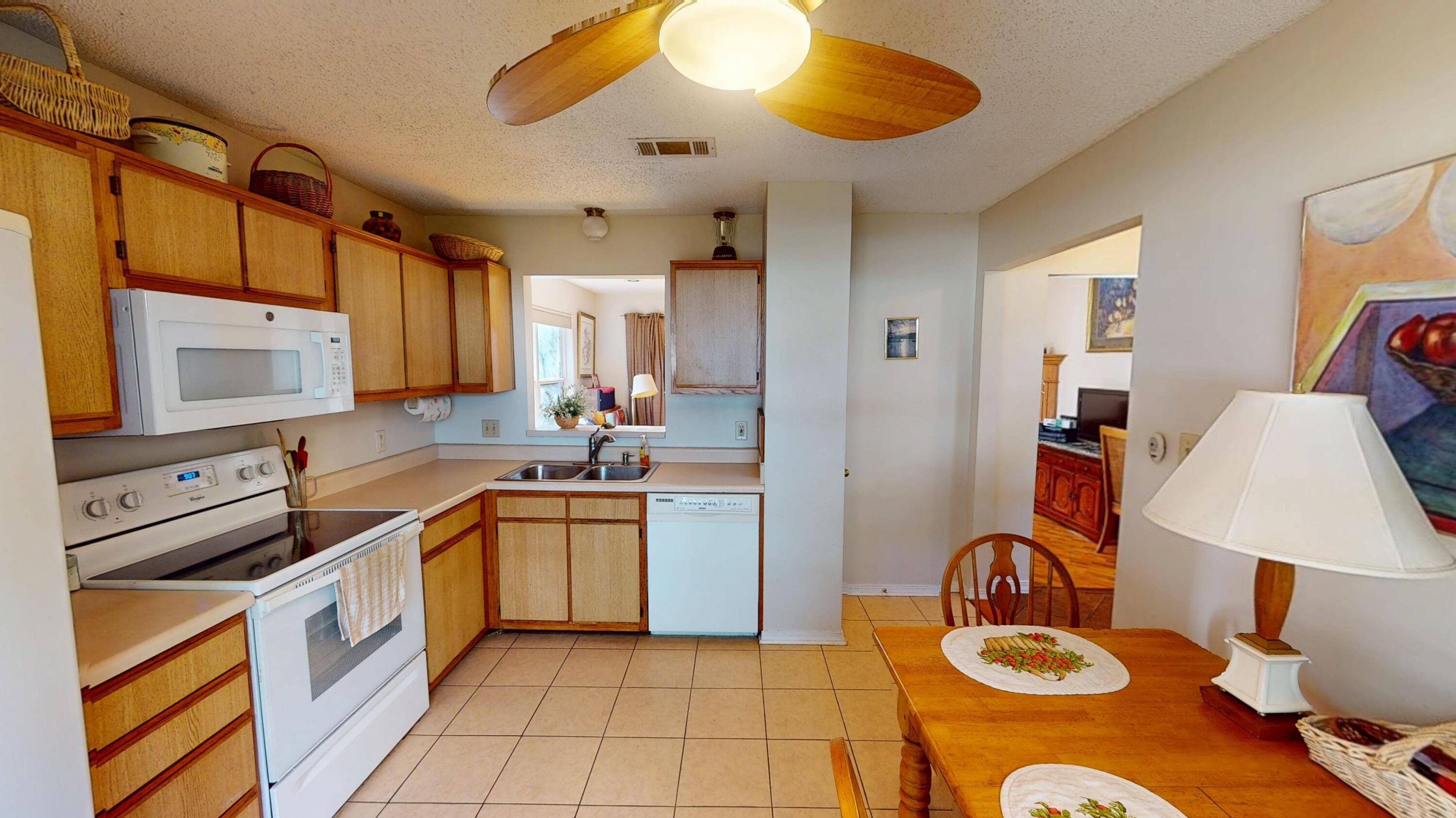 2293 Estate Circle Navarre, FL 32566 - Photo 16 of 41 a kitchen with a sink appliances and cabinets
