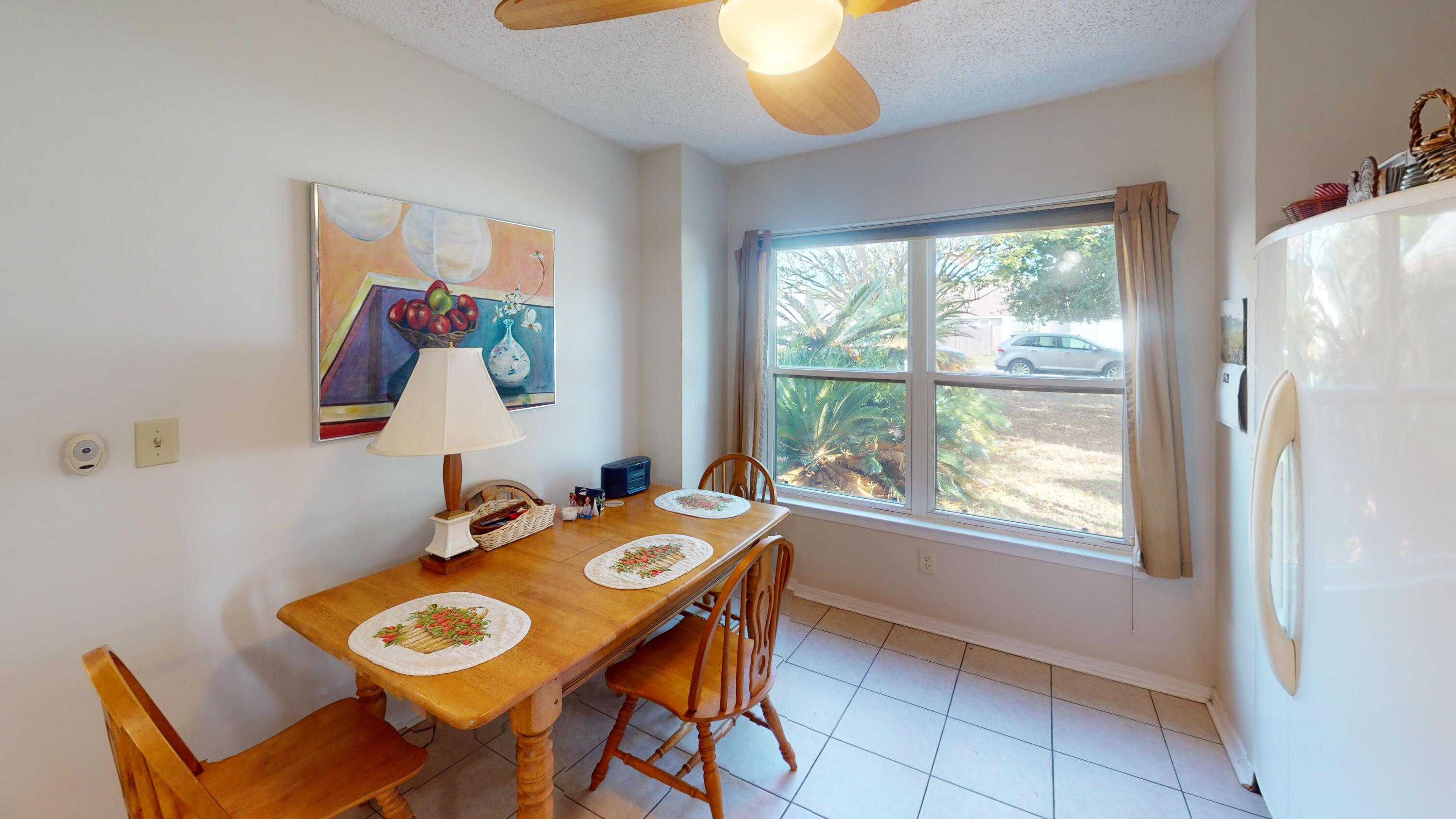 2293 Estate Circle Navarre, FL 32566 - Photo 17 of 41 a view of a dining room with furniture and window