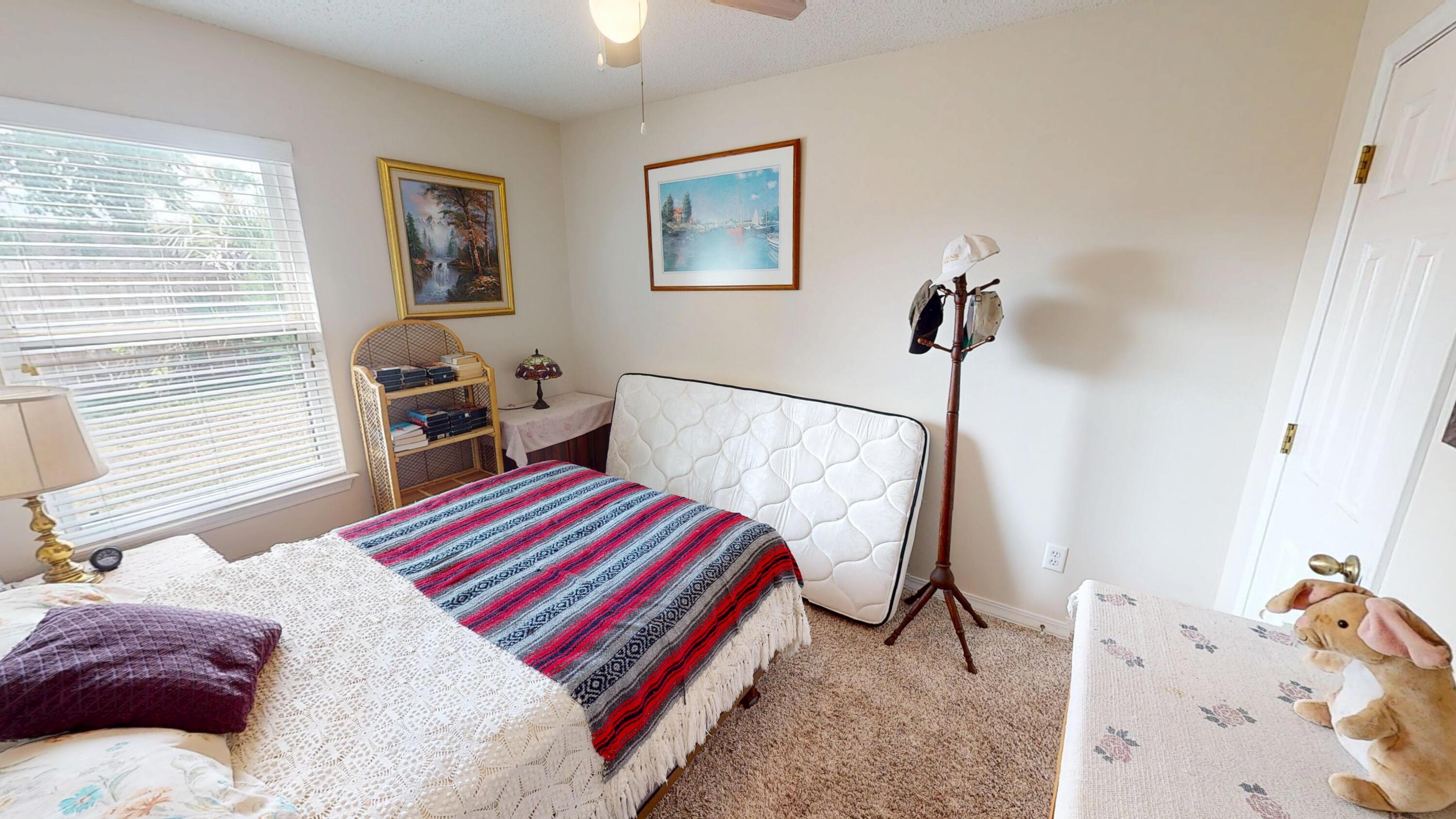 2293 Estate Circle Navarre, FL 32566 - Photo 25 of 41 a bedroom with bed and a window
