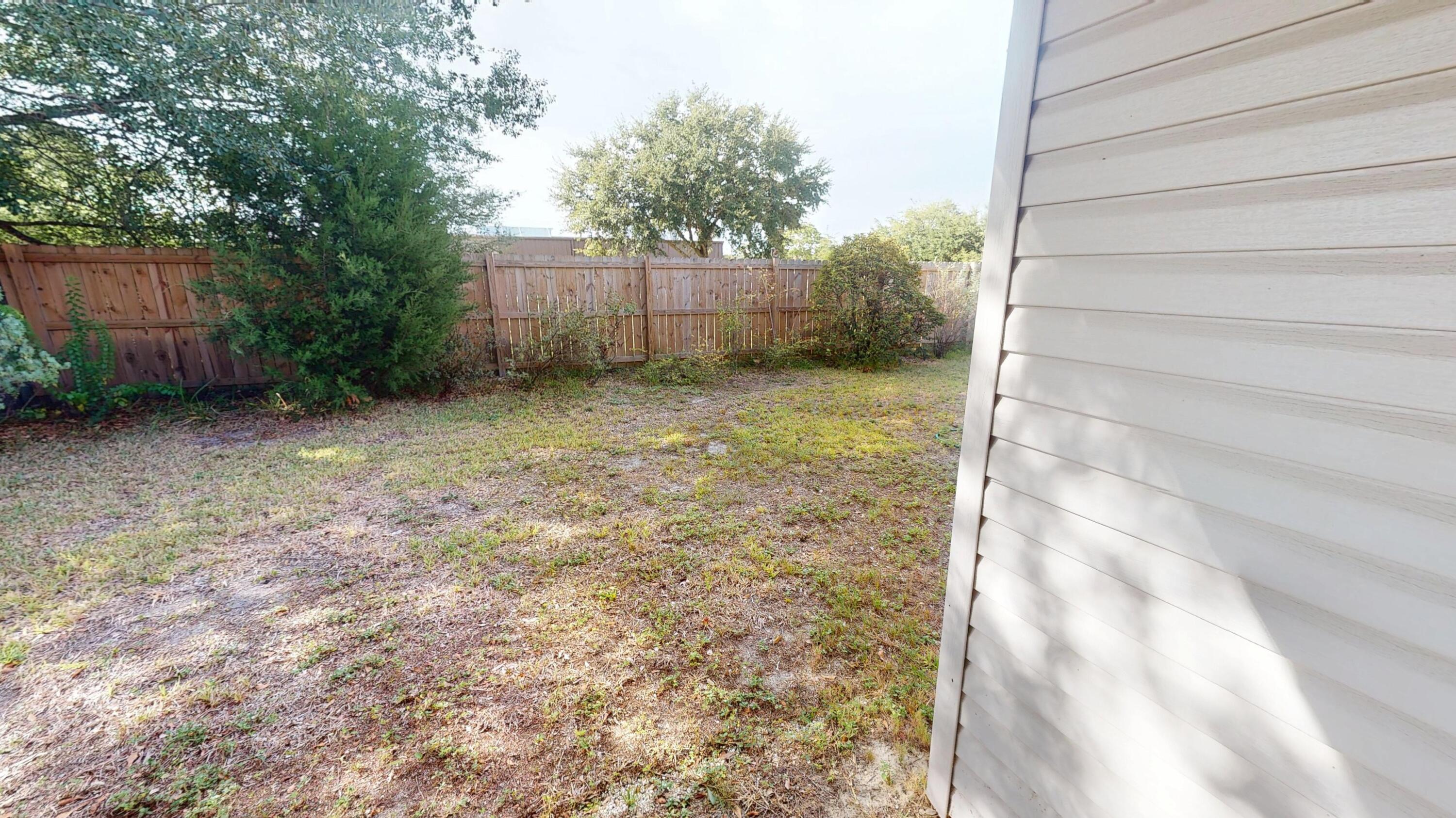 2293 Estate Circle Navarre, FL 32566 - Photo 37 of 41 a backyard of a house